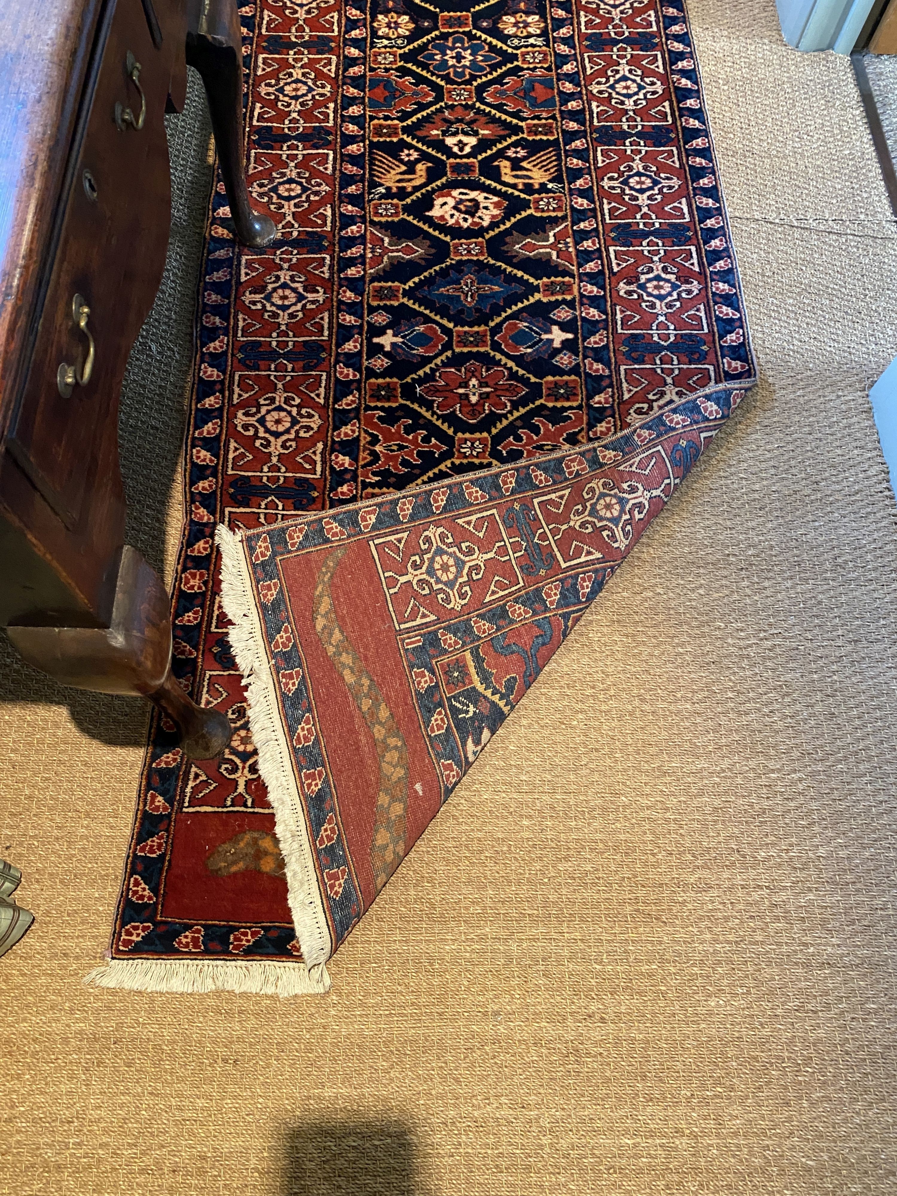 An unusually long Persian blue ground runner, with hexagon motifs, triple bordered, 6.8m x 89cm